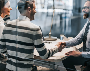 Business man shaking hands with a customer.